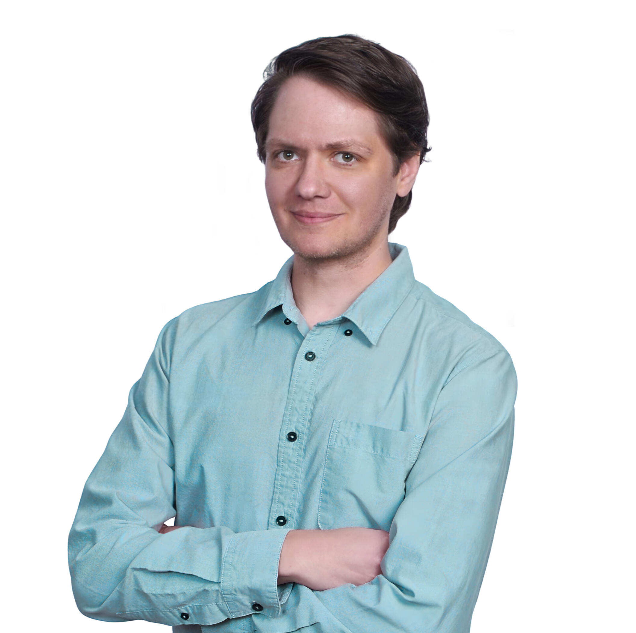 a man in a teal-colored button down shirt. His arms are folded and he's smiling.